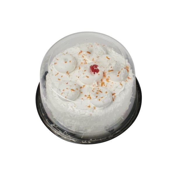 Bakery Desserts 7" Double Layer White Cake With Vanilla Whipped Icing And Real Coconut Shavings hero