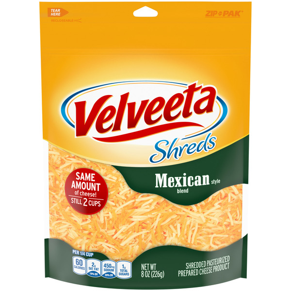 Packaged Cheese VELVEETA Shreds Mexican Style Blend Shredded Cheese hero