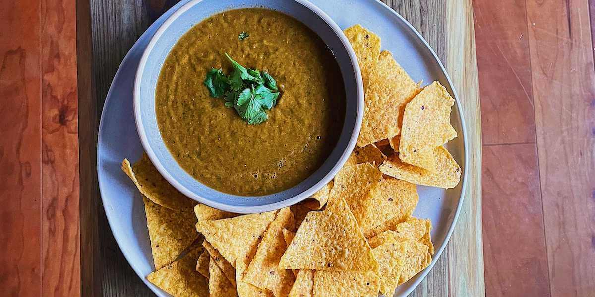 A crowd-pleasing salsa roja on a wood table.