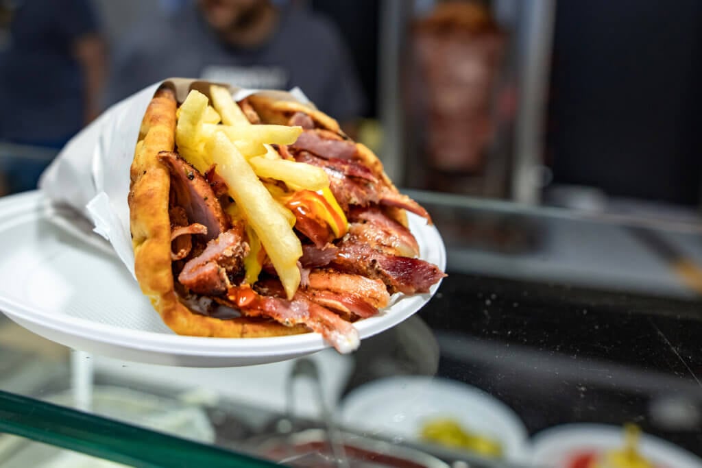 Gyros with pork on plate.