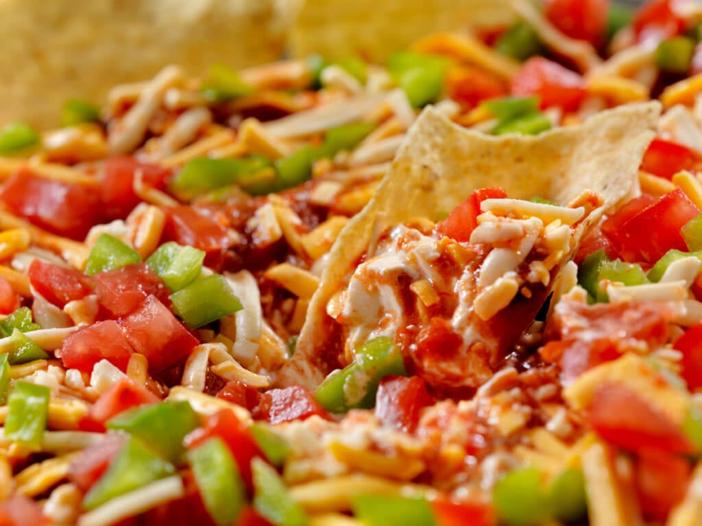 Layer Dip with Tortilla Chips.