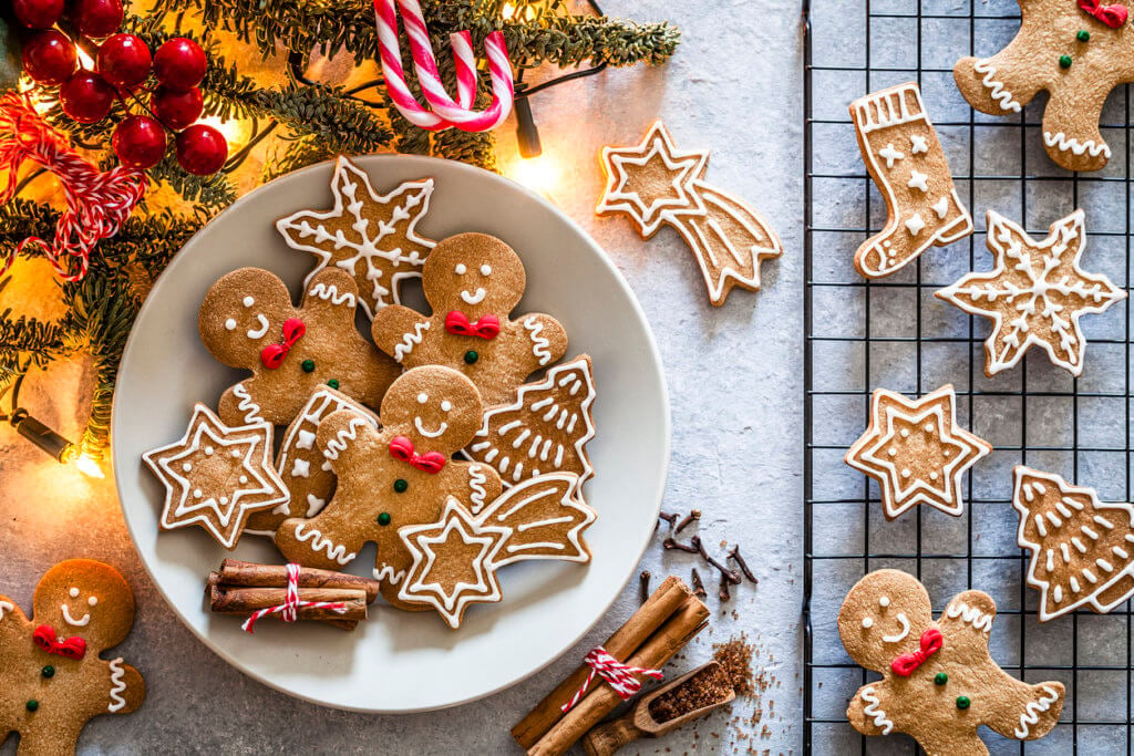 Top view of homemade Christmas cookies shot on gray Christmas table. 