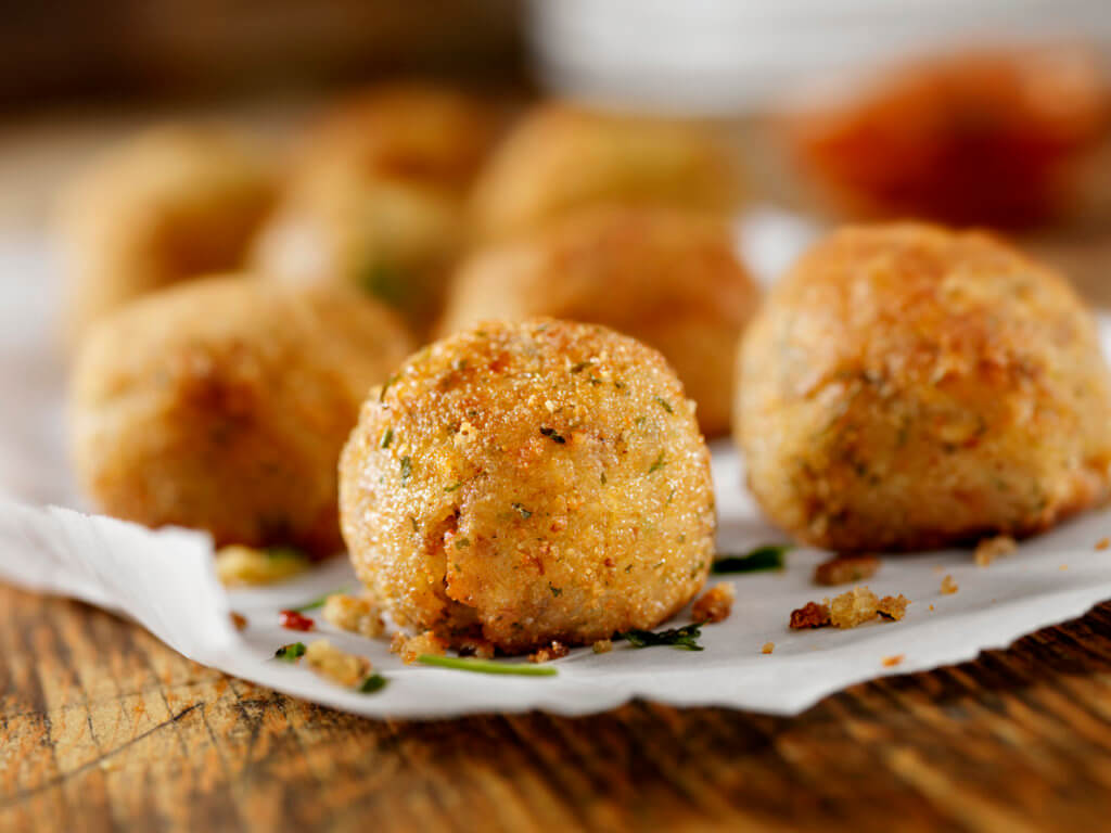 cheese Arancini on a table.