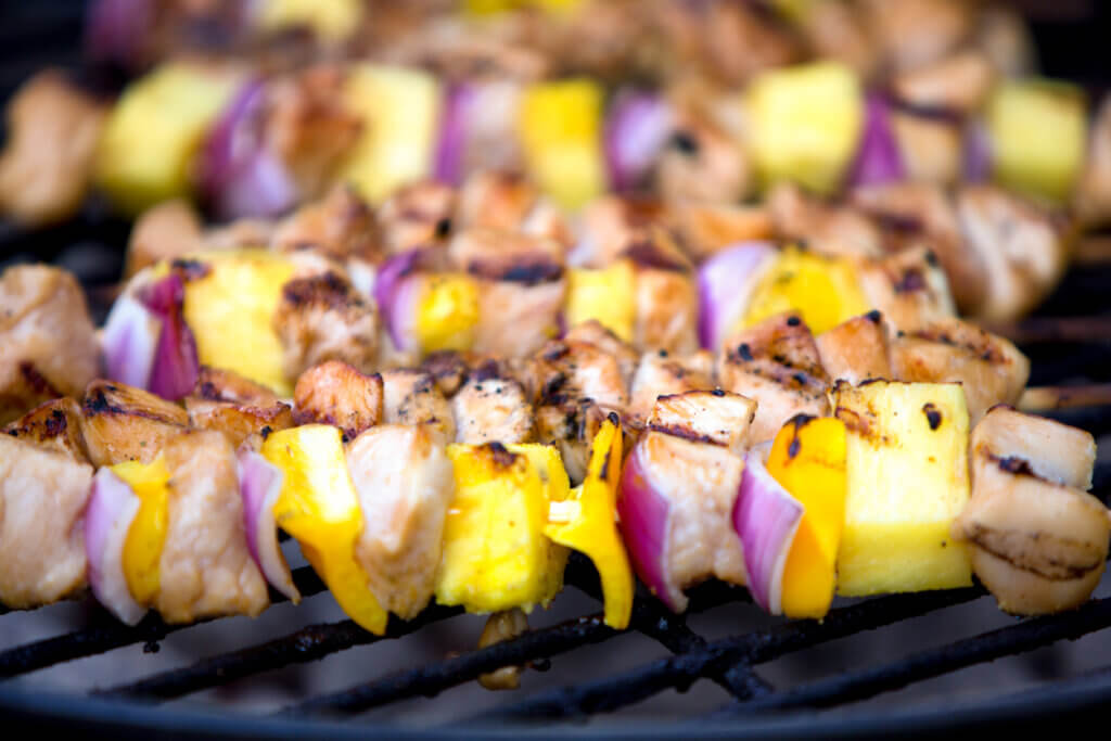 Chicken and Onion and Pineapple Shish Kebabs on a Grill