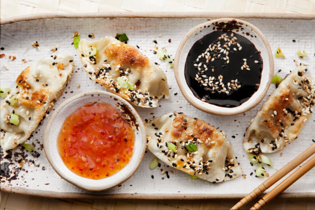 Sesame Seed Crusted Pan Fried Dumplings with Sweet and Sour and Soy Sauce