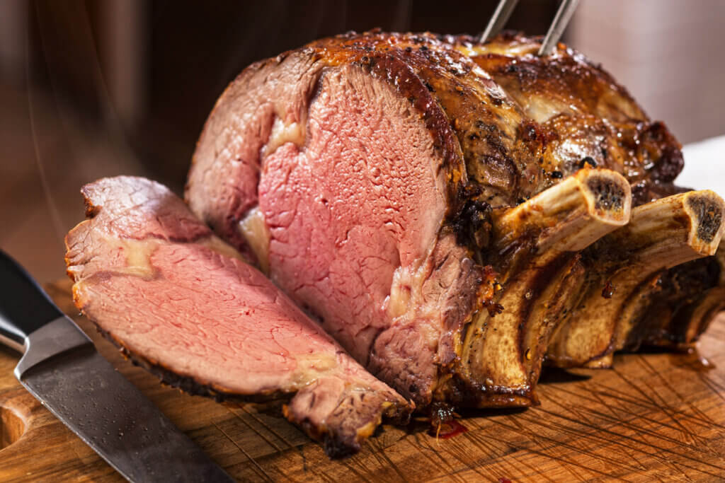 Prime rib roast on cutting board.