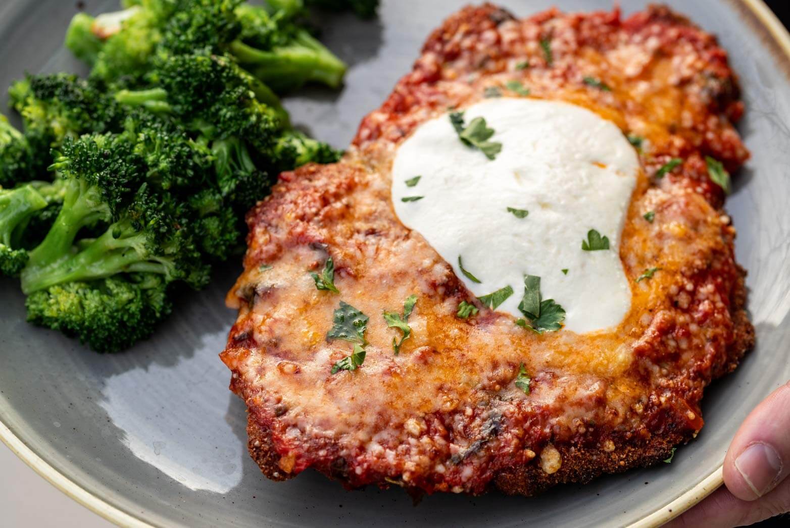 Close up of Air fryer Parmesan chicken with broccoli