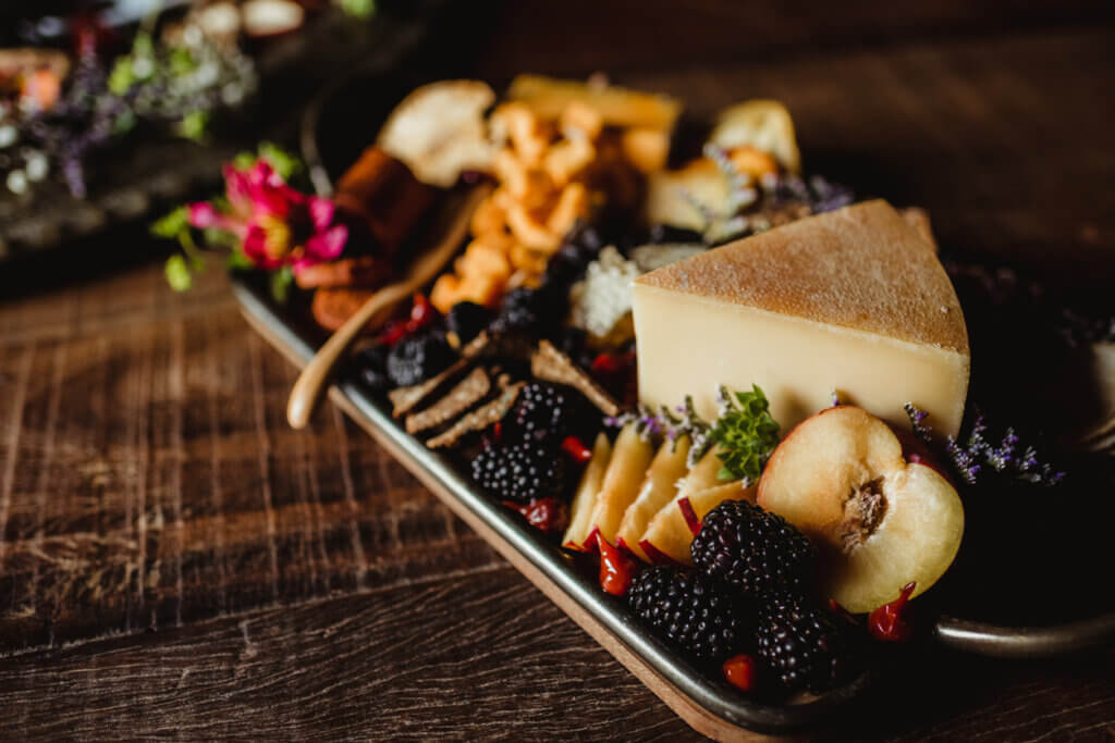 Charcuterie tray party food in a rustic setting