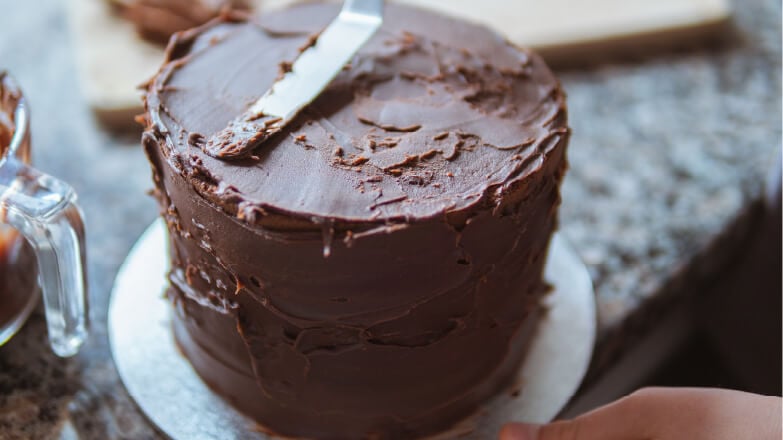 cake covered in chocolate frosting