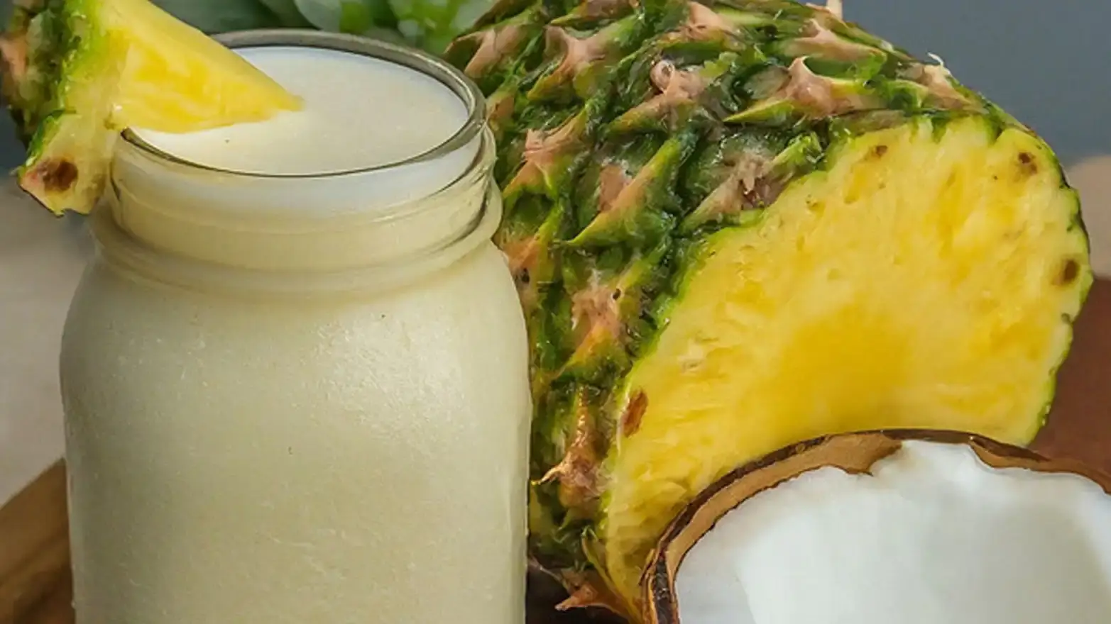 virgin pina colada with sliced pineapple.