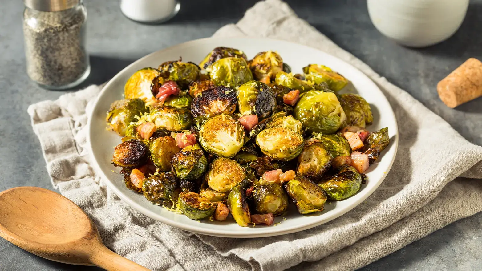 Roasted brussel sprouts on white plate.