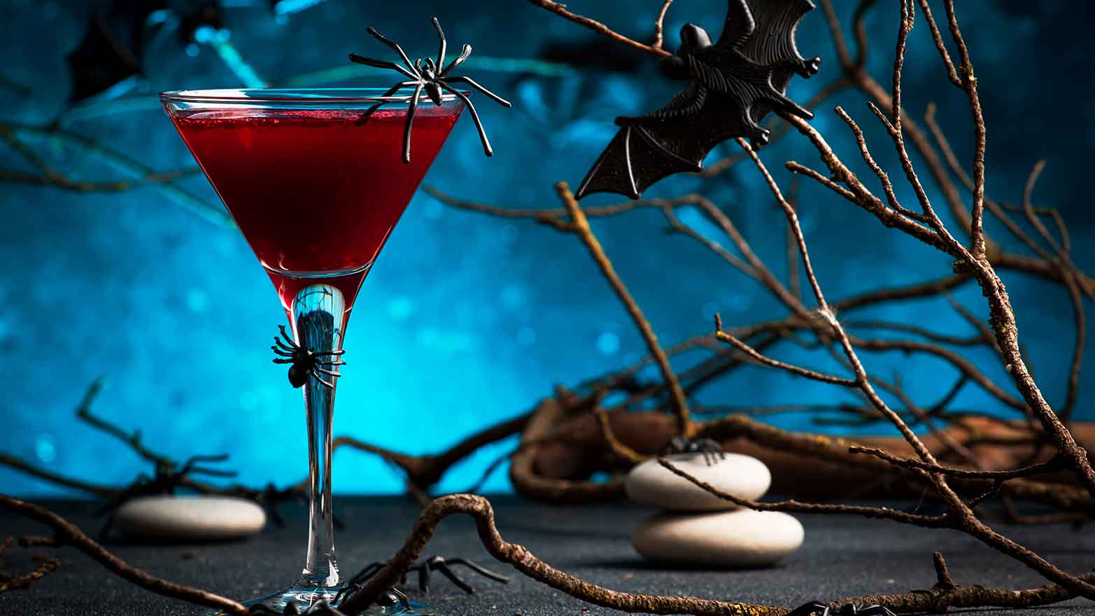 Poison apple martini with plastic spiders