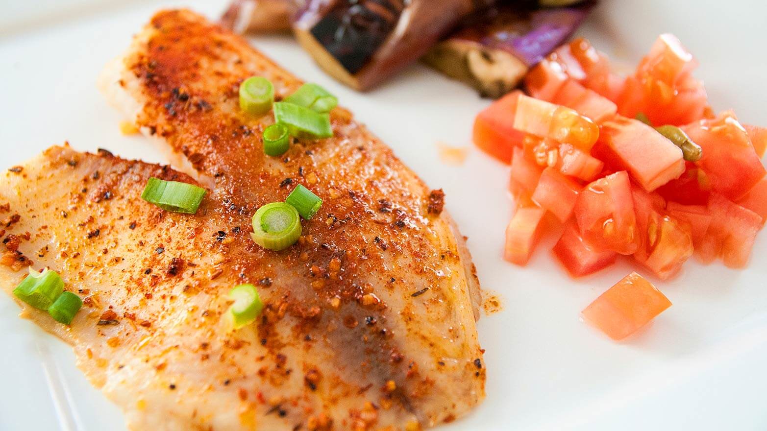 Baked tilapia with crushed tomatoes