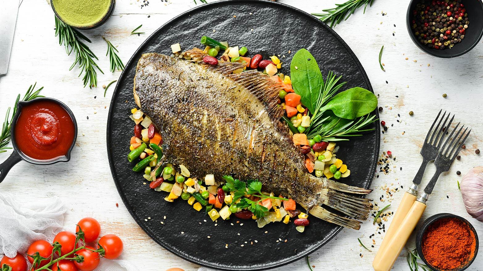 Baked flounder on a bed of vegetables