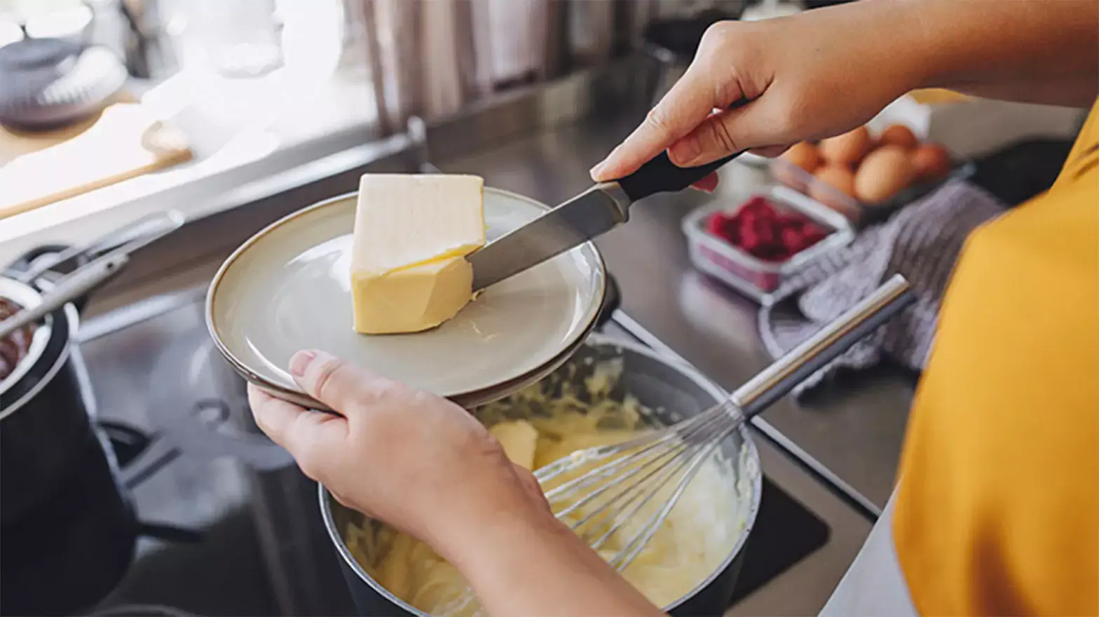 Stock image of family cooking with butter substitutes.