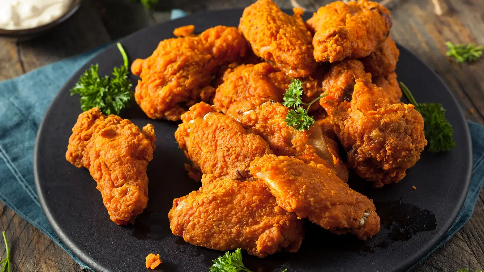 Plate of spicy fried chicken ready to serve at super bowl party