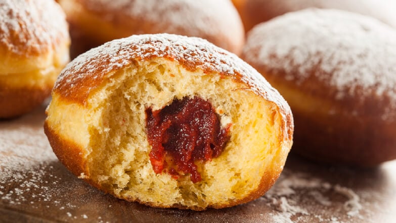 Jelly donuts topped with powdered sugar