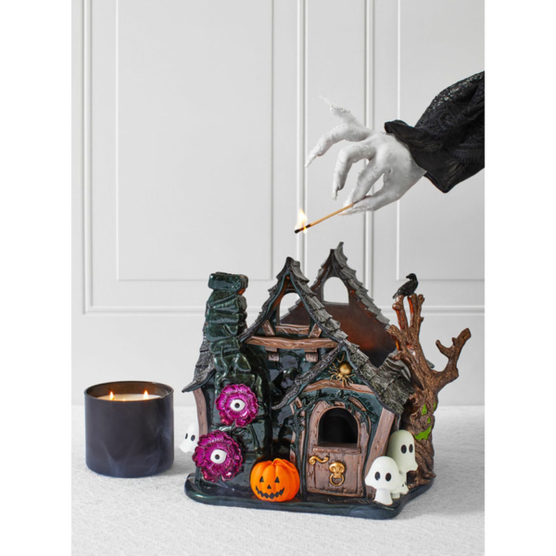 Bath and retailer Bodyworks haunted house luminary candle holder